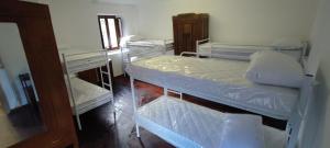 a small room with two bunk beds in it at CASA ALPINA Don Fisanotti - Piazzette - Usseglio in Usseglio +8 photos