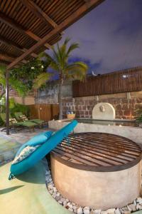 a pool with two blue surfboards in a swimming pool at Casa Abuelita: An exquisite, historic La Paz home in La Paz