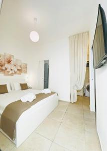 TV a/nebo společenská místnost v ubytování Paradise Rooms