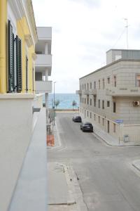 a view of an empty street from a building at Trilogia Salentina x AP Apartment in Gallipoli