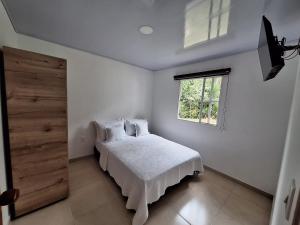 A bed or beds in a room at Hotel Diego Pacho Még 37 kép