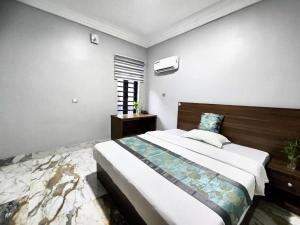 Krevet ili kreveti u jedinici u okviru objekta 万豪商务公寓酒店