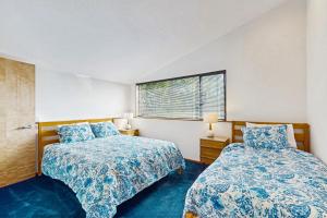a bedroom with two beds and a window at Green Vale Getaway - 2 Bed 2 Bath Vacation home in Sea Ranch in Sea Ranch +30 photos