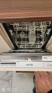 an oven with the dishes inside of it at FMI174 Apartment in Neu Isenburg