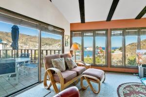 a living room with a view of the ocean at 130MT 130 Middle Terrace in Avalon