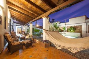 a porch with a hammock on a house at private Pool, walk to malecón, 2 BR estilo hacienda in La Paz