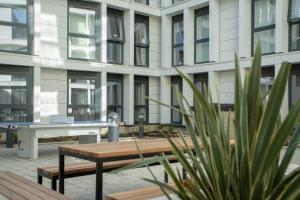 a table and bench in front of a building at Market House in Newcastle in Newcastle upon Tyne