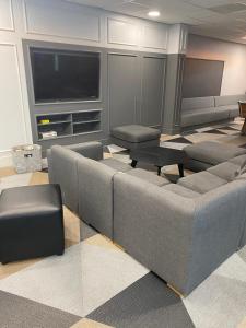 a living room with a couch and a flat screen tv at Market House in Newcastle in Newcastle upon Tyne