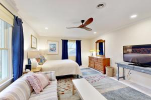 a living room with a couch and a bed at Town of Bethany Beach --- 431 Collins St in Bethany Beach