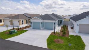 a row of houses in a residential neighborhood at Cozy Family Stay- Queen-Double-Twins Bed- Full Kitchen-Netflix-Golf Cart-WiFi in Okahumpka