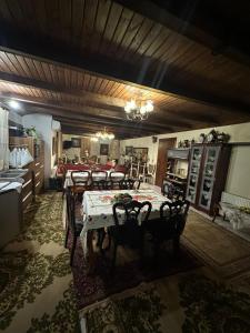 a dining room with a table and some chairs at Archontiko Brides of Meteora in Kalabaka