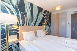 Postel nebo postele na pokoji v ubytování Sunset Resort 307