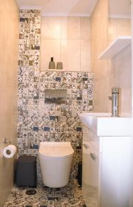 Ένα μπάνιο στο Zen Beach Front Suite