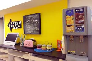 a kitchen with a counter with a cash register at Sleep Taipei in Taipei