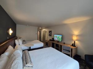 Postel nebo postele na pokoji v ubytování Rayland Hotel
