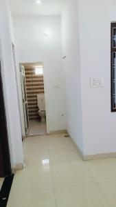 an empty bathroom with a toilet in a room at Glorious Room's in Aonla