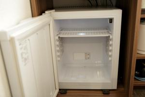 an empty white refrigerator with its door open at Tokyo Inn - Vacation STAY 74544v in Tokyo