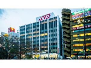 a large office building with a kyro sign on it at First Cabin Ichigaya "Capsule room only" - Vacation STAY 57138v in Tokyo