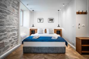 Posteľ alebo postele v izbe v ubytovaní Nest Ozana