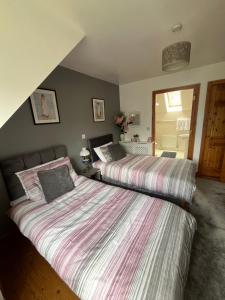 Katil atau katil-katil dalam bilik di Cozy Holiday Home in the Scenic Glen of Aherlow