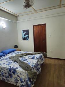 Postel nebo postele na pokoji v ubytování Trina Cozy Suites