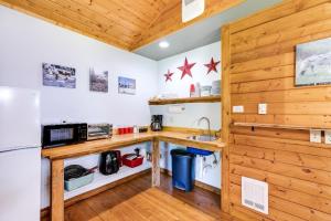 a kitchen with a counter and a refrigerator at Making lasting memories while enjoying this unique glamping experience in Maple Falls