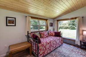 a living room with a couch and a window at Making lasting memories while enjoying this unique glamping experience in Maple Falls