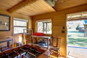 a room with a table and chairs in a cabin at Making lasting memories while enjoying this unique glamping experience in Maple Falls +12 photos