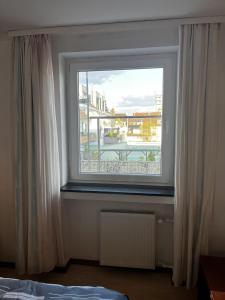 Postel nebo postele na pokoji v ubytování Hotel Tenova Köln-Neumarkt