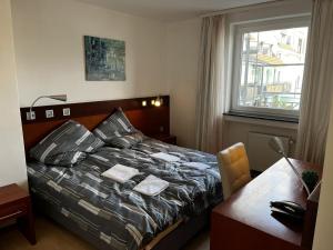 Postel nebo postele na pokoji v ubytování Hotel Tenova Köln-Neumarkt