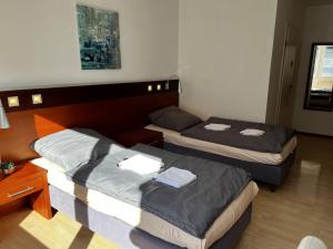Postel nebo postele na pokoji v ubytování Hotel Tenova Köln-Neumarkt