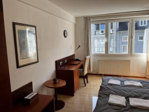 Postel nebo postele na pokoji v ubytování Hotel Tenova Köln-Neumarkt