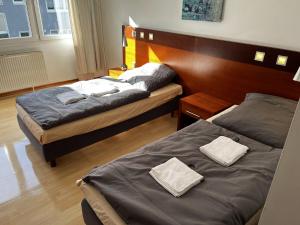 Postel nebo postele na pokoji v ubytování Hotel Tenova Köln-Neumarkt