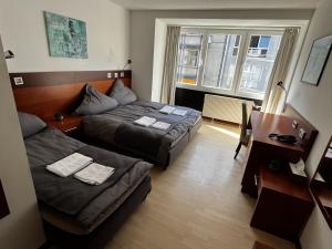 Postel nebo postele na pokoji v ubytování Hotel Tenova Köln-Neumarkt