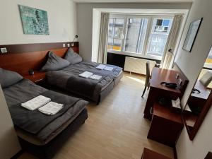 Postel nebo postele na pokoji v ubytování Hotel Tenova Köln-Neumarkt
