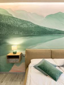 A bed or beds in a room at Solema Lake Como