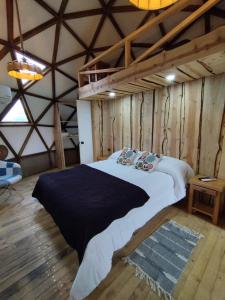 Postel nebo postele na pokoji v ubytování Hostal & Domos Bello Horizonte