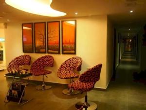 a group of chairs sitting in a room at Hotel O Crossroads Hotel in Kuala Lumpur +23 photos