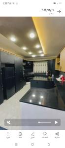 a view of a kitchen with a counter top at فيلا الاحلام in Irbid +10 photos