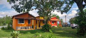 a small house with an orange at Sitio148 Hospedaria in Penedo