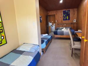 Postel nebo postele na pokoji v ubytování Bunkhouse Motel Cooma
