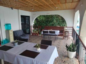 a patio with a table and chairs on a balcony at SEASCAPE in Moalboal