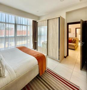 Postel nebo postele na pokoji v ubytování Skynest Residences Nairobi, Westlands
