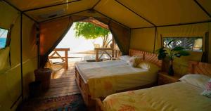 Postel nebo postele na pokoji v ubytování Glamping EcoLodge Cueva De Las Aguilas