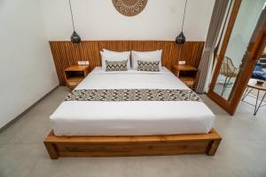Letto o letti in una camera di Kemari Ubud