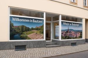 a building with posters in the windows of a building at Savor City Appartement Am Lauenturm Zentrum 5 Personen in Bautzen