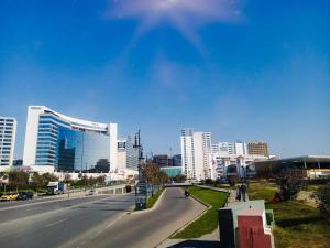a view of a city with a street and buildings at Cozy equipped apartment near train station facing Hilton luxury comfort in Tangier
