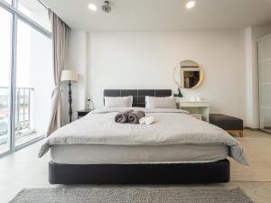 Postel nebo postele na pokoji v ubytování Stirling Homestay by Evernent