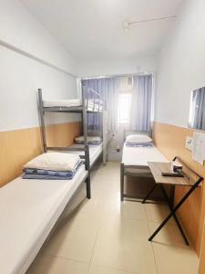 Katil atau katil-katil dalam bilik di Ah Shan Hostel