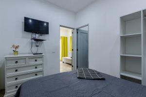 Ένα ή περισσότερα κρεβάτια σε δωμάτιο στο El Patio de Lucia Residencia